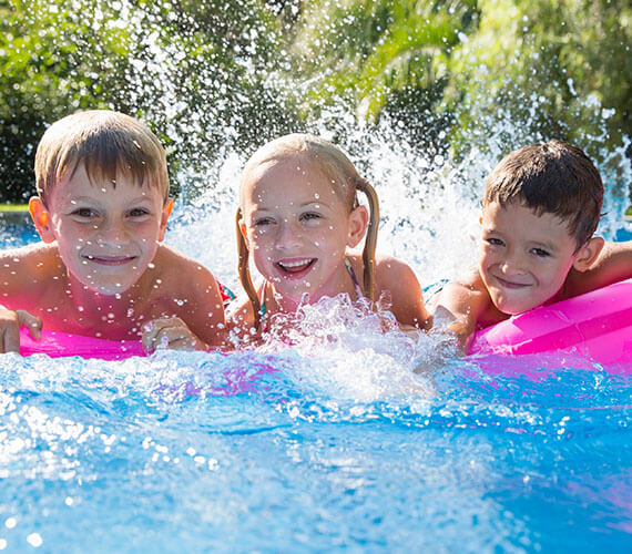 Family enjoying boogie-boarding and playful currents with BADU Stream II