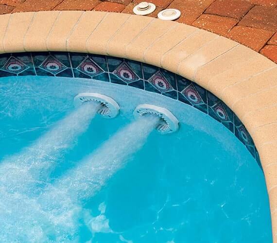 Flush-mounted jets preserving pool space and clean look